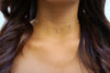 Seven-gem choker modeled on a woman with long hair