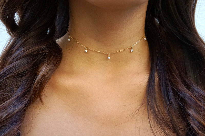 Seven-gem choker modeled on a woman with long hair