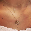 16" Angel Baby Coin Necklace on a model, layered with our lightning bolt choker.