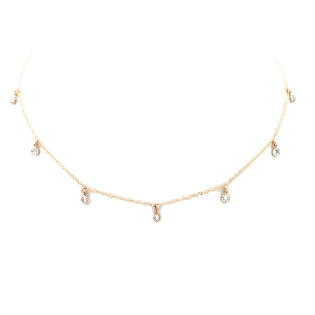 7-Gem choker, with a gold chain and seven clear gemstones.